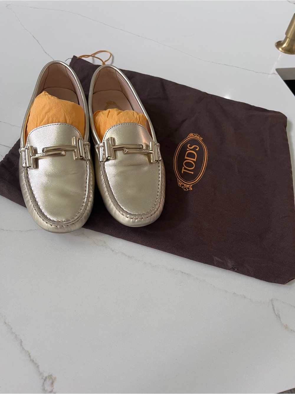 TOD'S women’s Metallic Gold Leather Bit Loafers